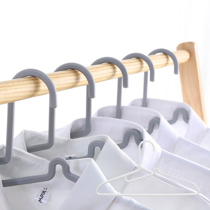 A sturdy home clothes hanger for dorm or student use, non-slip and scratch-free.